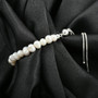 natural white freshwater pearl bolo bracelet in rhodium over sterling silver shown in a lifestyle photo