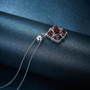 side view of garnet roped cluster pendant necklace in rhodium over sterling silver