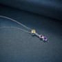 side view of multi gemstone bar drop pendant necklace in rhodium over sterling silver