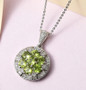 peridot and white zircon pendant necklace in rhodium over sterling silver shown in a lifestyle photo