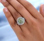 natural peridot and white zircon cluster ring in rhodium over sterling silver worn on a hand