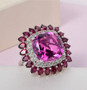 pink quartz rhodolite garnet and white zircon ring in rhodium over sterling silver shown in a lifestyle photo