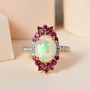 ethiopian opal rhodolite garnet and zircon 18k yellow gold over sterling silver halo ring shown in a lifestyle photo