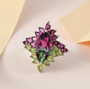 marquise bi color quartz triplet rhodolite garnet and peridot halo ring in rhodium over sterling silver shown in a lifestyle photo