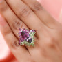 marquise bi color quartz triplet rhodolite garnet and peridot halo ring in rhodium over sterling silver worn on a hand
