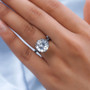 natural white topaz round solitaire ring in black rhodium over sterling silver worn on a hand