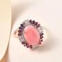 pink opal rhodolite garnet and zircon halo ring in 18k rose gold over sterling silver shown in a lifestyle photo