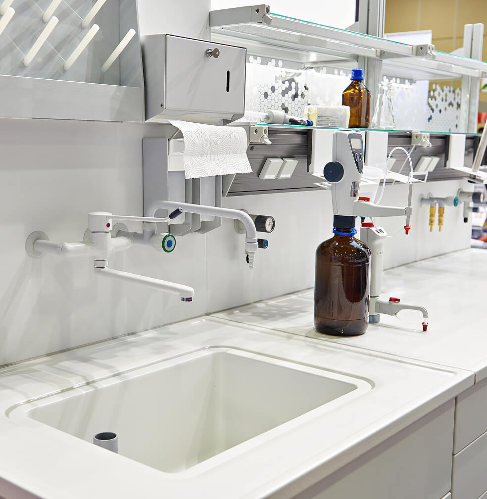 Sterile and organized sink and counter of a chemical laboratory.