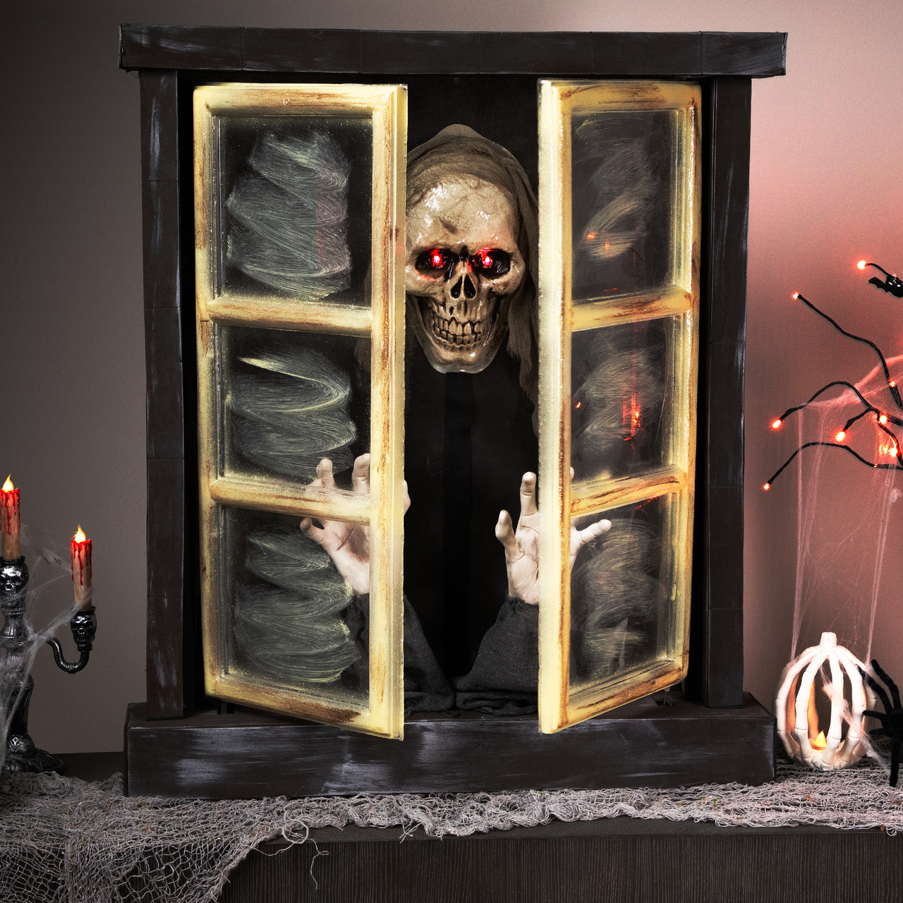 lighted and animated ghoul in window