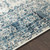 5.25' Gray and Blue Distressed Finish Round Area Throw Rug