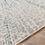 7.8' x 10.25' Abstract Patterned Ivory and Blue Rectangular Area Throw Rug