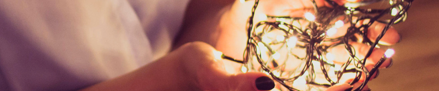 closeup of hand holding white micro lights