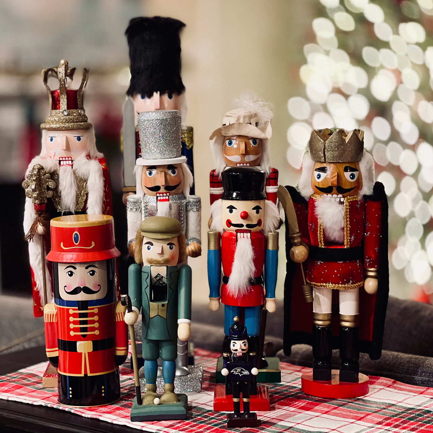 nutcracker collection arranged on plaid tray