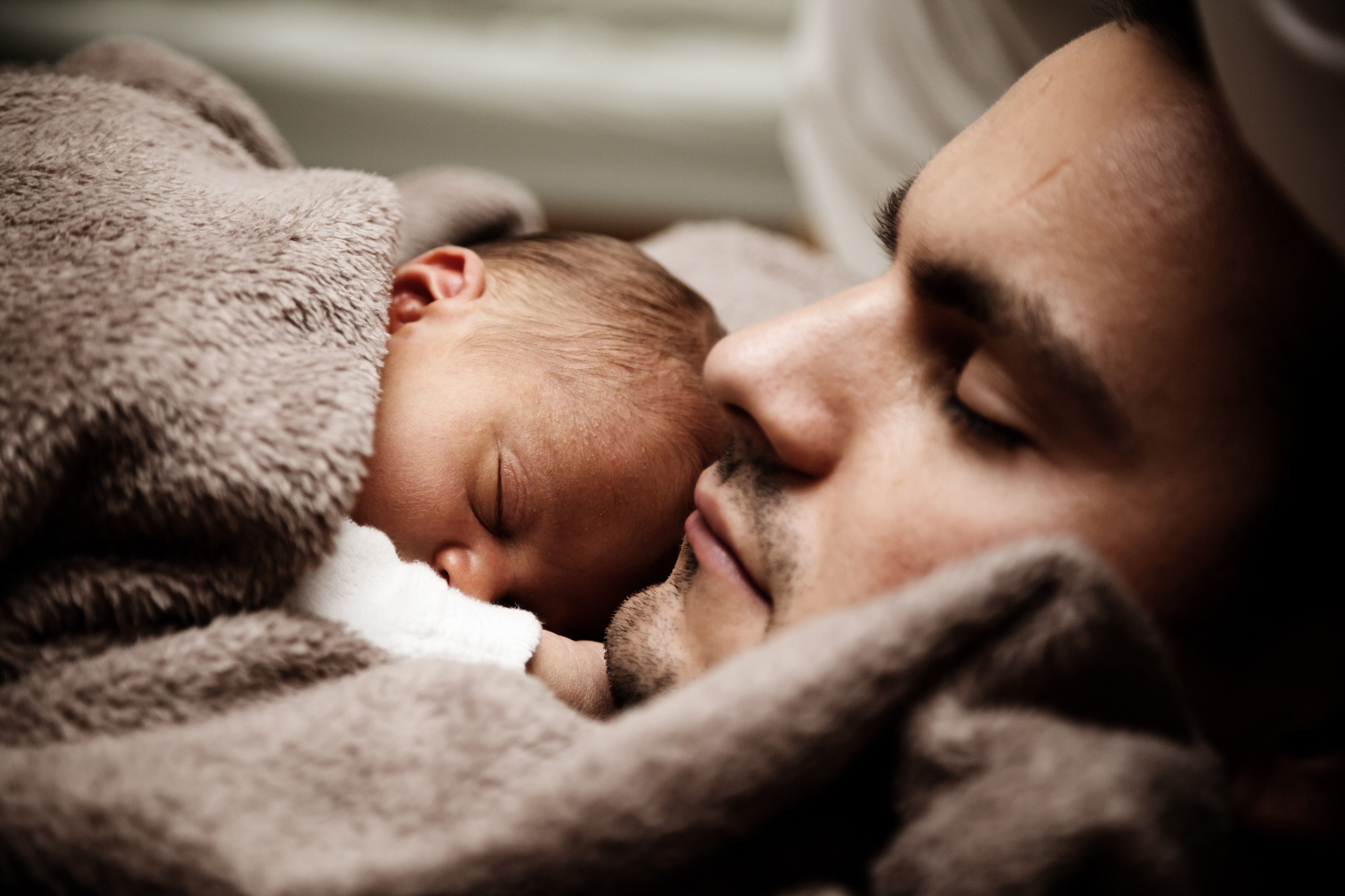 dad and infant nap together