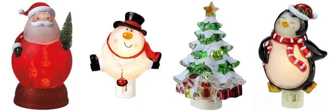 Four Christmas themed night lights, from left, Santa, snowman, Christmas tree, penguin