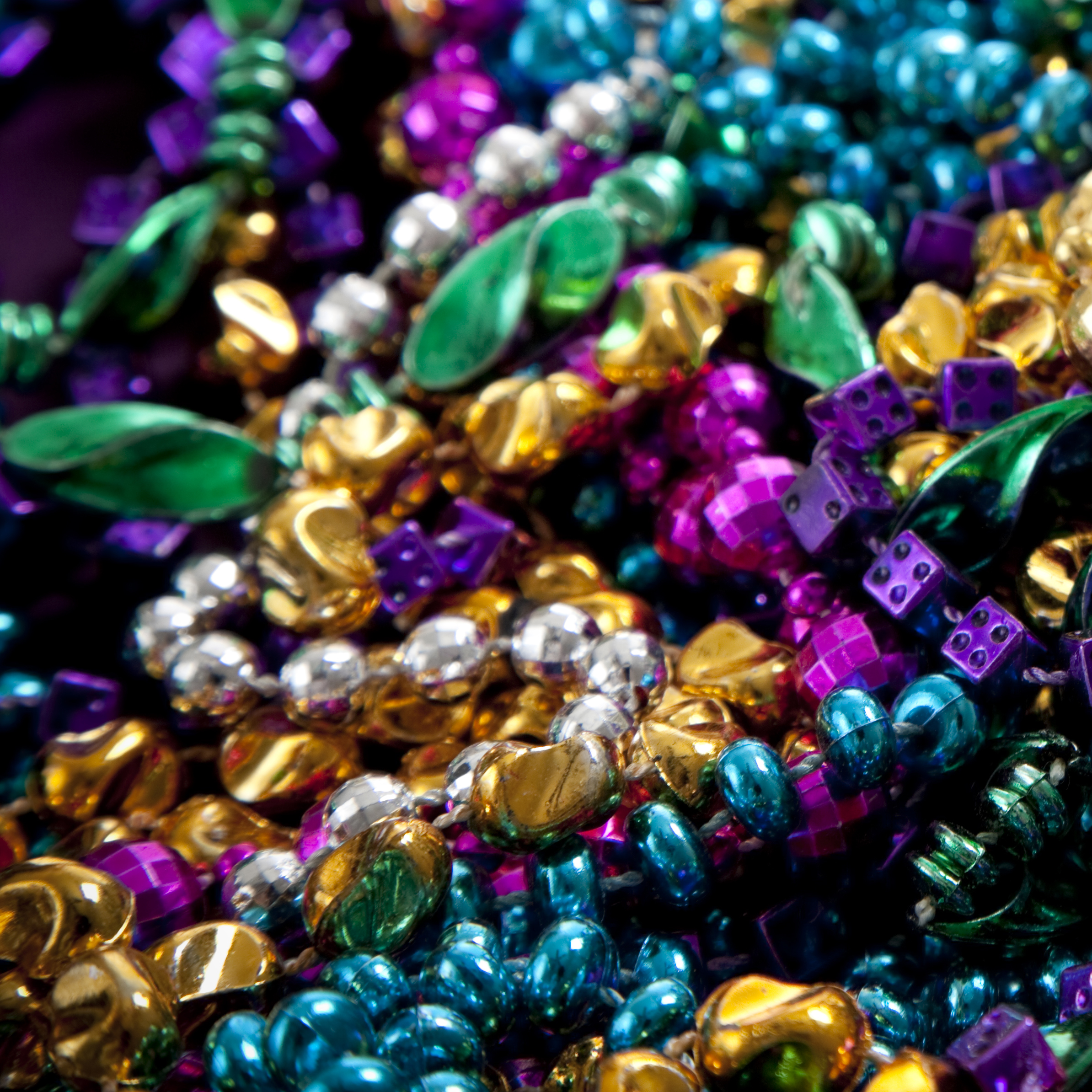 close up of colorful mardi gras beads