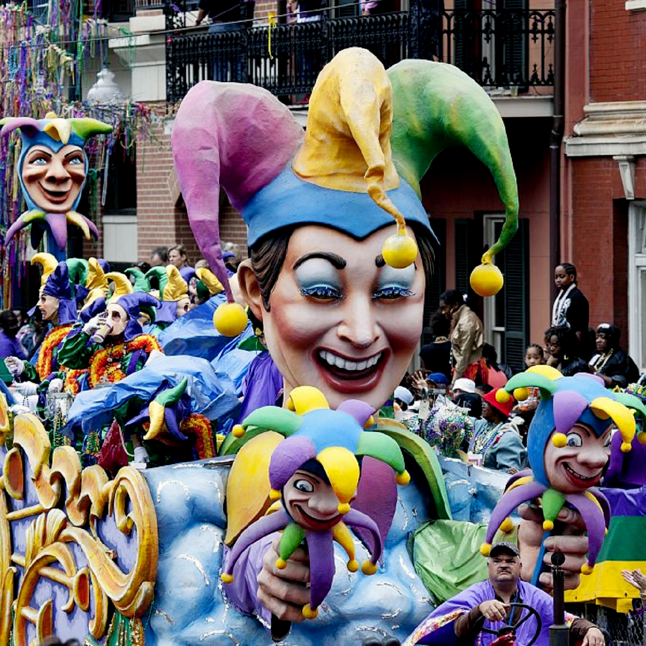 a jester float makes its way down the Mardi Gras parade route