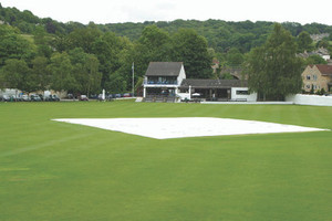 Tildenet lay flat rain cover pulled over cricket wicket Tildenet lay flat rain cover pulled over cricket wicket