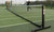 Wheelaway Freestanding Tennis Posts in use at an outdoor tennis court