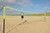 beach volleyball player using the portable volleyball net
