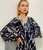 WOVEN TROPICAL PRINT PEPLUM TOP, BLACK/MULTI