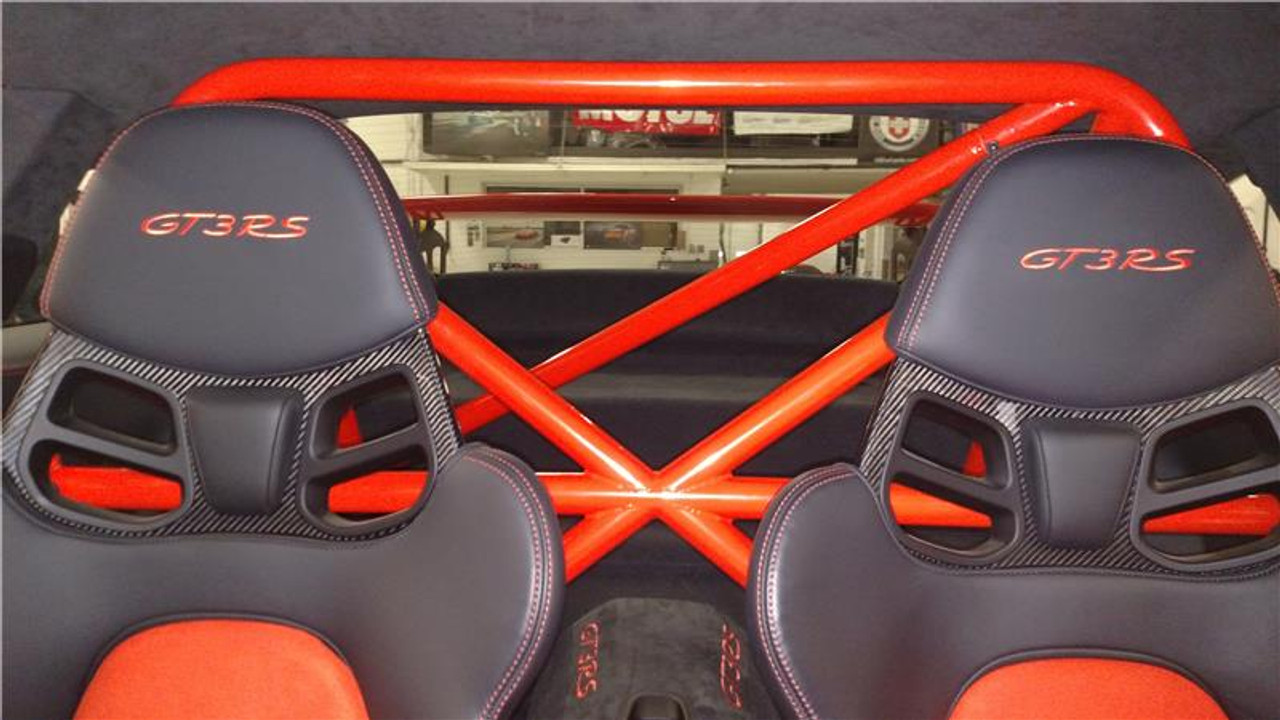 RSS 940-XC Series 4pt. Roll Bar (991 GT3 / RS & 991 Without Sunroof/Moonroof)

o The RSS 940-XC Series 4pt. Roll Bar features the “X-Cross” main hoop design providing superior occupant protection

o The XC’s one piece Main Hoop mounts to a reinforced chassis cross member at the B Pillar which runs the full width of the vehicle. Unlike other designs, the Main Hoop has a maximum of four bends featuring a Straight Top Tube Section forming a stronger more rigid main hoop.

o The 940-XC is a safety inspired design which mounts shoulder harnesses directly behind the occupants attaching at the main hoop horizontal bar. The main hoop mounting position greatly enhances safety by reducing the effects of “Harness Stretch.” Harness Stretch is a serious safety concern commonly overlooked with other designs.

What is Harness Stretch? Simply put, safety harness-belts allow a certain percentage of stretch during a rapid deceleration event, the longer the harness-belt, the more overall stretch it will allow. This unsafe forward movement can be dangerous, especially when airbags deploy. By significantly shortening harness-belt length (mounting to main hoop vs. rear compartment of vehicle) occupant torsos are securely anchored against the seats reducing this unwanted excessive forward movement.

o Rear Down Tubes feature precision cut and reinforced mounting plates that attach to rear shock towers incorporating all three shock mounting points, maximizing contact area to evenly distribute load.

o The Rear Diagonal Brace provides additional main hoop and rear shock tower triangulation and increases chassis rigidity.

o The 940-XC allows full seat base travel with standard seats, OE buckets or racing buckets and allows full use of factory seat belts. (Easily fits 6’4 inch driver in Recaro SPG XL Racing Seat).

o Bolt-In Installation does not require drilling of chassis or cutting of interior side panels common with other bars. The Bar uses vehicles existing hardware, carpet panel trimming is required at B and C Pillar. Professional installation is recommended for a factory installed look.

o Available in 5 Durable Powder Coat Finishes (at no additional charge): White, Silver, Satin Black, Speed Yellow, Guards Red or uncoated for custom color matching.

o Designed, Crafted, Tig Welded, and Powder Coated at the RSS Fabrication Center utilizing 1.50 inch DOM, CNC machined heavy duty locking tube couplers, and precision cut reinforced mounting plates.

o Patent Pending Design