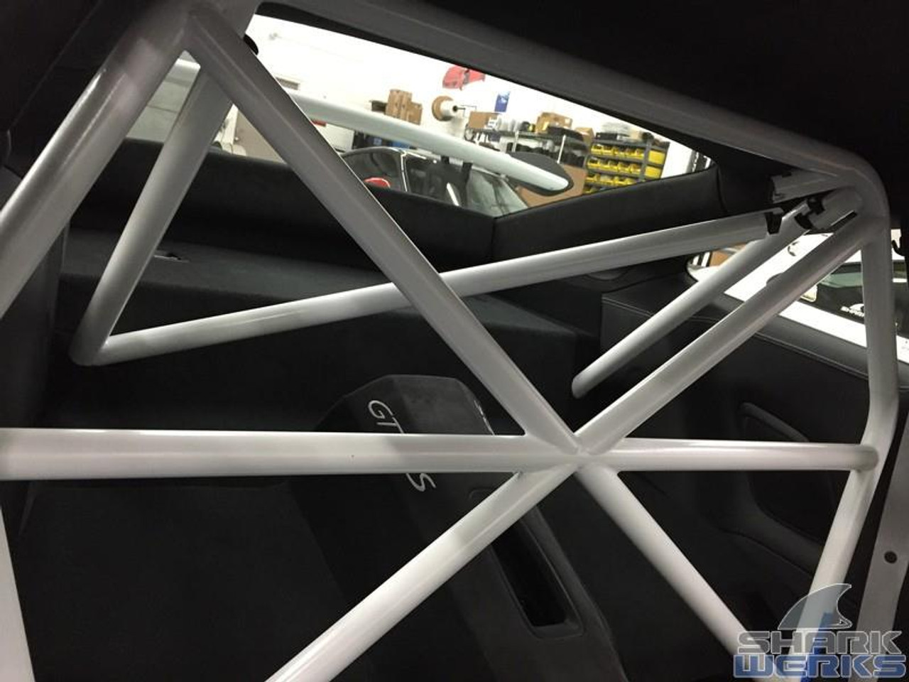 RSS 940-XC Series 4pt. Roll Bar (991 GT3 / RS & 991 Without Sunroof/Moonroof)

o The RSS 940-XC Series 4pt. Roll Bar features the “X-Cross” main hoop design providing superior occupant protection

o The XC’s one piece Main Hoop mounts to a reinforced chassis cross member at the B Pillar which runs the full width of the vehicle. Unlike other designs, the Main Hoop has a maximum of four bends featuring a Straight Top Tube Section forming a stronger more rigid main hoop.

o The 940-XC is a safety inspired design which mounts shoulder harnesses directly behind the occupants attaching at the main hoop horizontal bar. The main hoop mounting position greatly enhances safety by reducing the effects of “Harness Stretch.” Harness Stretch is a serious safety concern commonly overlooked with other designs.

What is Harness Stretch? Simply put, safety harness-belts allow a certain percentage of stretch during a rapid deceleration event, the longer the harness-belt, the more overall stretch it will allow. This unsafe forward movement can be dangerous, especially when airbags deploy. By significantly shortening harness-belt length (mounting to main hoop vs. rear compartment of vehicle) occupant torsos are securely anchored against the seats reducing this unwanted excessive forward movement.

o Rear Down Tubes feature precision cut and reinforced mounting plates that attach to rear shock towers incorporating all three shock mounting points, maximizing contact area to evenly distribute load.

o The Rear Diagonal Brace provides additional main hoop and rear shock tower triangulation and increases chassis rigidity.

o The 940-XC allows full seat base travel with standard seats, OE buckets or racing buckets and allows full use of factory seat belts. (Easily fits 6’4 inch driver in Recaro SPG XL Racing Seat).

o Bolt-In Installation does not require drilling of chassis or cutting of interior side panels common with other bars. The Bar uses vehicles existing hardware, carpet panel trimming is required at B and C Pillar. Professional installation is recommended for a factory installed look.

o Available in 5 Durable Powder Coat Finishes (at no additional charge): White, Silver, Satin Black, Speed Yellow, Guards Red or uncoated for custom color matching.

o Designed, Crafted, Tig Welded, and Powder Coated at the RSS Fabrication Center utilizing 1.50 inch DOM, CNC machined heavy duty locking tube couplers, and precision cut reinforced mounting plates.

o Patent Pending Design