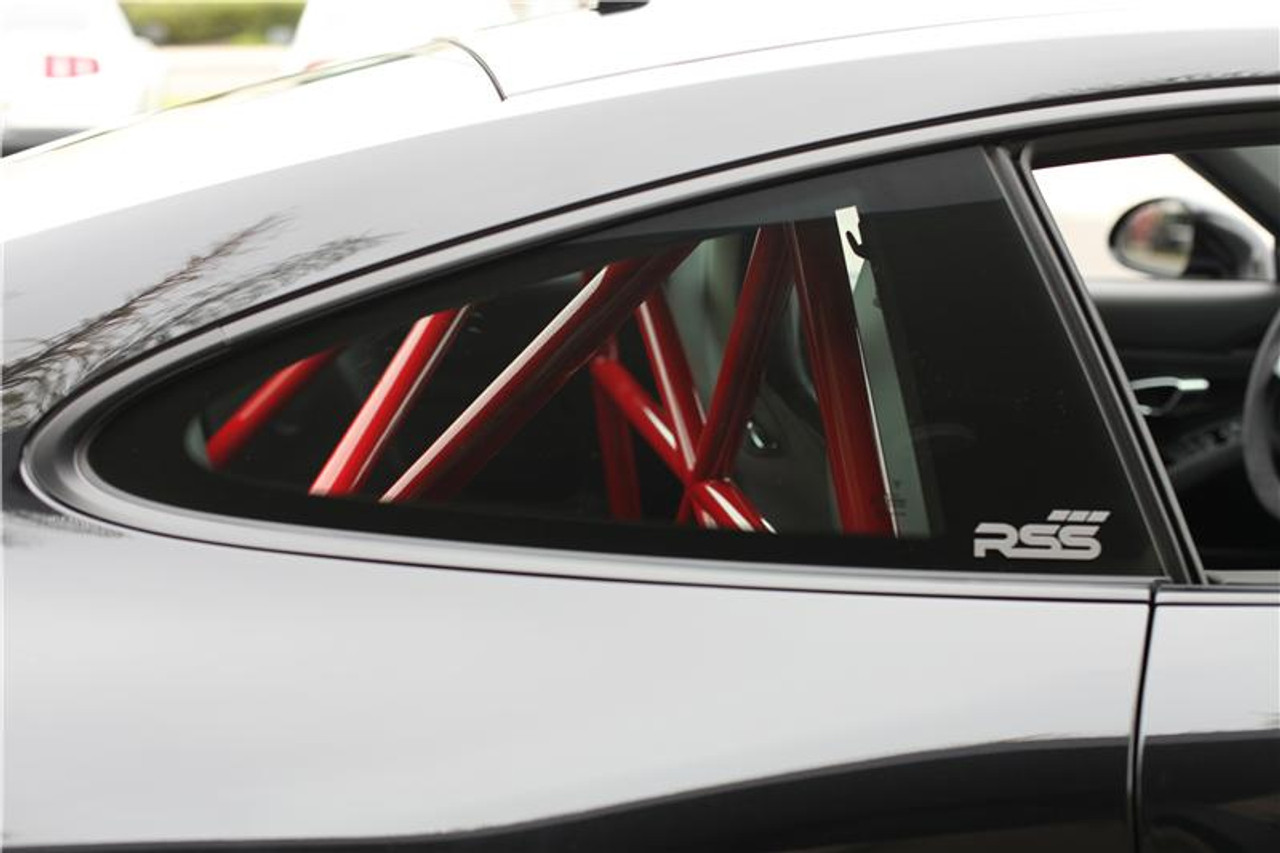 RSS 940-XC Series 4pt. Roll Bar (991 GT3 / RS & 991 Without Sunroof/Moonroof)

o The RSS 940-XC Series 4pt. Roll Bar features the “X-Cross” main hoop design providing superior occupant protection

o The XC’s one piece Main Hoop mounts to a reinforced chassis cross member at the B Pillar which runs the full width of the vehicle. Unlike other designs, the Main Hoop has a maximum of four bends featuring a Straight Top Tube Section forming a stronger more rigid main hoop.

o The 940-XC is a safety inspired design which mounts shoulder harnesses directly behind the occupants attaching at the main hoop horizontal bar. The main hoop mounting position greatly enhances safety by reducing the effects of “Harness Stretch.” Harness Stretch is a serious safety concern commonly overlooked with other designs.

What is Harness Stretch? Simply put, safety harness-belts allow a certain percentage of stretch during a rapid deceleration event, the longer the harness-belt, the more overall stretch it will allow. This unsafe forward movement can be dangerous, especially when airbags deploy. By significantly shortening harness-belt length (mounting to main hoop vs. rear compartment of vehicle) occupant torsos are securely anchored against the seats reducing this unwanted excessive forward movement.

o Rear Down Tubes feature precision cut and reinforced mounting plates that attach to rear shock towers incorporating all three shock mounting points, maximizing contact area to evenly distribute load.

o The Rear Diagonal Brace provides additional main hoop and rear shock tower triangulation and increases chassis rigidity.

o The 940-XC allows full seat base travel with standard seats, OE buckets or racing buckets and allows full use of factory seat belts. (Easily fits 6’4 inch driver in Recaro SPG XL Racing Seat).

o Bolt-In Installation does not require drilling of chassis or cutting of interior side panels common with other bars. The Bar uses vehicles existing hardware, carpet panel trimming is required at B and C Pillar. Professional installation is recommended for a factory installed look.

o Available in 5 Durable Powder Coat Finishes (at no additional charge): White, Silver, Satin Black, Speed Yellow, Guards Red or uncoated for custom color matching.

o Designed, Crafted, Tig Welded, and Powder Coated at the RSS Fabrication Center utilizing 1.50 inch DOM, CNC machined heavy duty locking tube couplers, and precision cut reinforced mounting plates.

o Patent Pending Design