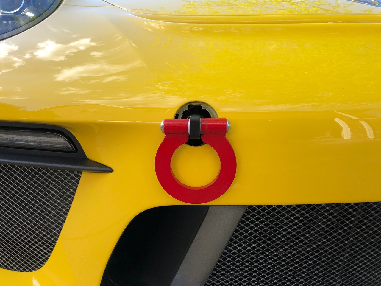 941/34 Folding Tow Hook 991.1 - 991.2 Gt2/GT3/RS, 991, 970, 971, 981, 718, Finish: BLACK. RSS Tow Hooks for Porsche Automobiles. Designed, engineered and manufactured in USA. High quality and functionality for your Porsche. RSS Folding Tow Hooks for Porsche Models are engineered with a 90 Degree Angle Stop Design and with Adjustable Bumper Offset to prevent bumper cover contact. Made in USA at RSS. Easy to Install, Screws Into Factory Location; Black 1018 Steel Shaft w/Stainless Steel Hoop; Angle of Hoop is Adjustable; 2” Opening; Utilizes Special Factory Porsche Thread Style; BLACK (#941/30), and RED (#941/34).