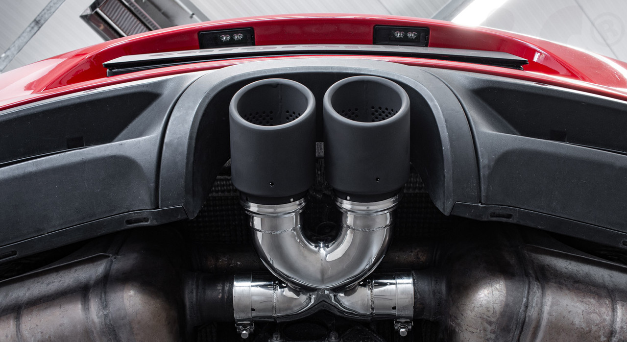 Product Description:CARGRAPHIC Sport Double Tailpipe Ø 89mm / 3.5" inch

Consisting of:

CARGRAPHIC Performance X-tailpipe beam construction made of SS304L lightweight stainless steel
2x CARGRAPHIC 89mm / 3.5" inch sport tailpipes, double-walled, oblique, rolled up with perforation insert, made of SS304L lightweight stainless steel
Finish: Matt Black Thermopaint
Suitable for:
Porsche 981 Boxster / Boxster S / GTS / Spyder
Porsche 981 Cayman / Cayman S / GTS / GT4
For use with standard or CARGRAPHIC rear silencer

Features:
The original tailpipe support is a "T" - shaped design with a direct, frontal gas flow collision, which generates turbulence and exhaust gas back pressure. The CARGRAPHIC Performance X-pipe construction, on the other hand, has radial inlet elbows with a flow-optimized mixing chamber, which allows the exhaust gas flow to flow out efficiently without resistance.

X-pipe design flow-optimized
Made of SS304L lightweight stainless steel on CNC tube bending machine with mandrel support (Mandrel-bent), which enables exhaust pipes with a constant diameter
High-performance components tested and tested on the test bench
Easy installation due to sliding system
Thanks to the split-ring design, the tailpipe trims can be adjusted both in depth and axially
Reduced exhaust back pressure
Improved responsiveness - more agile and freer rotation
Powerful sound
Without droning noises, resonances or vibrations
More power and torque
Attention: CARGRAPHIC SS304L lightweight stainless steel tailpipe trims are available in the following versions:


Polished
Matt Black Thermopaint
Glossy black enamelled
Visible carbon matt finish with stainless steel liner
Visible carbon gloss finish with stainless steel liner
Lightweight brushed stainless steel
Lightweight Matt Black Thermopaint
Installation service:
You too can benefit from the installation and TÜV service in our modern and fully equipped workshop. Our team, consisting of experienced motorsport technicians and automotive workshop masters specializing in exclusive sports cars, carry out all orders professionally and with the utmost care.


