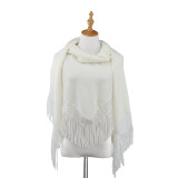 Front view of white tassle sweater wrap on white wooden mannequin stand