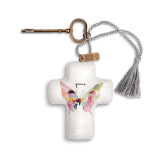ceramic cross with butterfly and word 'grace' printed on it tied to a brass key