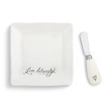 A white serving platter with "live deliciously" in black cursive font and a matching spreader.