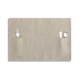 A taupe utensil pocket place mat with a set of silverware enclosed.