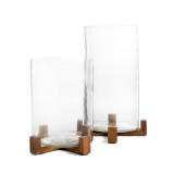 Two glass containers with wood bases one larger than the other