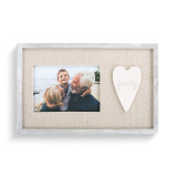 A light wooden frame with a tan center, a family photograph, and an ivory heart that states "family".
