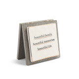 A gray wooden card with a ceramic plate that reads "beautiful family beautiful memories beautiful life".