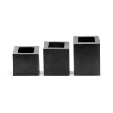 Three black metal cube vases.