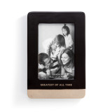 A black ceramic picture frame with a tan base, and reads "Greatest of all time".