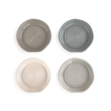 A set of four garlic grinder dishes with various shades of cream, green, and blue.