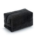 A black velvet rectangular toiletries bag with a zipper displayed angled to the left.