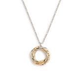 Close up detailed view of a gold and silver intertwined circle charm on a silver necklace.