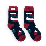 Dark blue and red fuzzy socks with books on them and a fabric tag that says "sorry, I'm all booked".