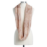 A blush colored infinity scarf displayed full length on a mannequin.