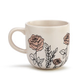 A front facing view of a cream coffee mug with several simple black and light pink roses stemming from the base.