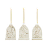 A set of three nativity scene engraved triptych ornaments, each with a different scene and story in gold lettering, but each topped with a star and a gold ribbon.