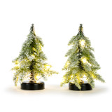 Two small lit fake evergreen trees with a frosted look on black bases.