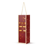 A lit wood holiday lantern with dark red front that says "May Your Nights Be Bubbly and Bright" with a rope handle at the top, displayed angled to the left.