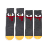 Two pairs of matching black socks with penguin faces and yellow toes. One is adult sized and the other is toddler sized.