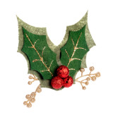 Green holly shaped fabric lapel pin embellished with red berries and gold stems, displayed angled to the right.